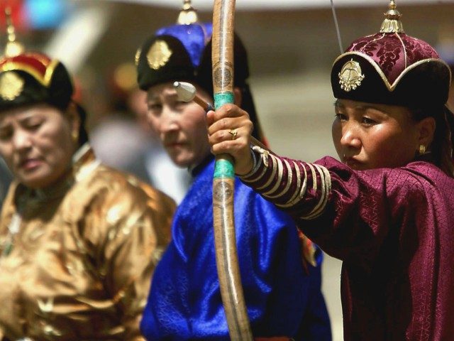 ULAN BATOR, MONGOLIA: Women dressed in traditional Mongolian clothing compete against each