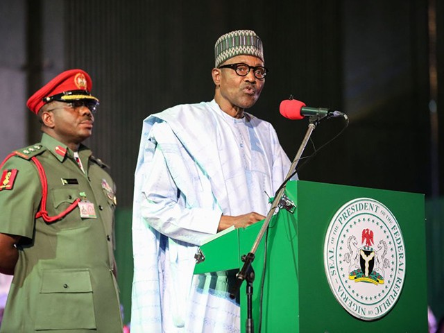Nigerian President Muhammadu Buhari (R) addresses the audience following his re-election, after Nigeria's Independent National Electoral Commission presented his certificate of election on February 27, 2019, in Abuja. - Muhammadu Buhari was on February 27 re-elected Nigeria's president after a delayed poll that angered voters and raised political temperatures, but the opposition immediately vowed to challenge the "sham" result in court. (Photo by Kola SULAIMON / AFP) (Photo credit should read KOLA SULAIMON/AFP via Getty Images)