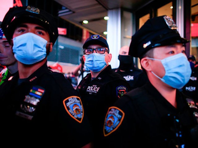 NYPD officers stand guard during a protest to demand justice for Daniel Prude, on Septembe