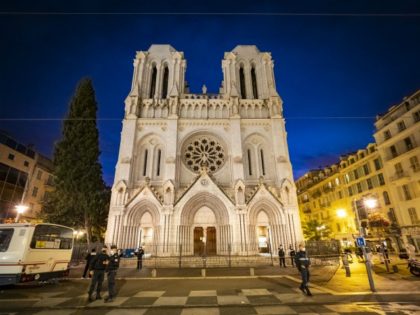 NICE, FRANCE - OCTOBER 29: Police patrol at night in front of basilica on October 29, 2020 in Nice, France. A man armed with a knife fatally attacked three people in the church, located in the heart of the city. (Photo by Arnold Jerocki/Getty Images)