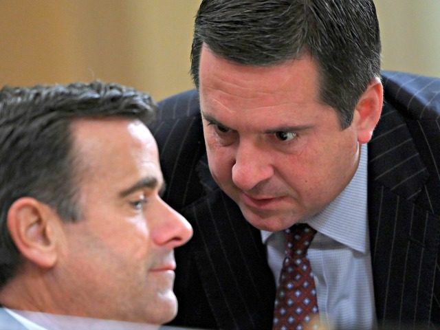 Ranking member Rep. Devin Nunes (R-CA) speaks with Rep. John Ratcliffe (R-TX) during the House Intelligence Committee hearing, into President Donald Trump's alleged efforts to tie US aid for Ukraine to investigations of his political opponents, on Capitol Hill in Washington, DC on November 19, 2019. - The US ambassador …