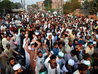 Supporters of Tehreek-e-Labbaik Pakistan march during a protest in Lahore on October 30