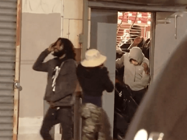 Looters clean out a Foot Locker store in West Philadelphia. (Video Screenshot/NBC10 Philad