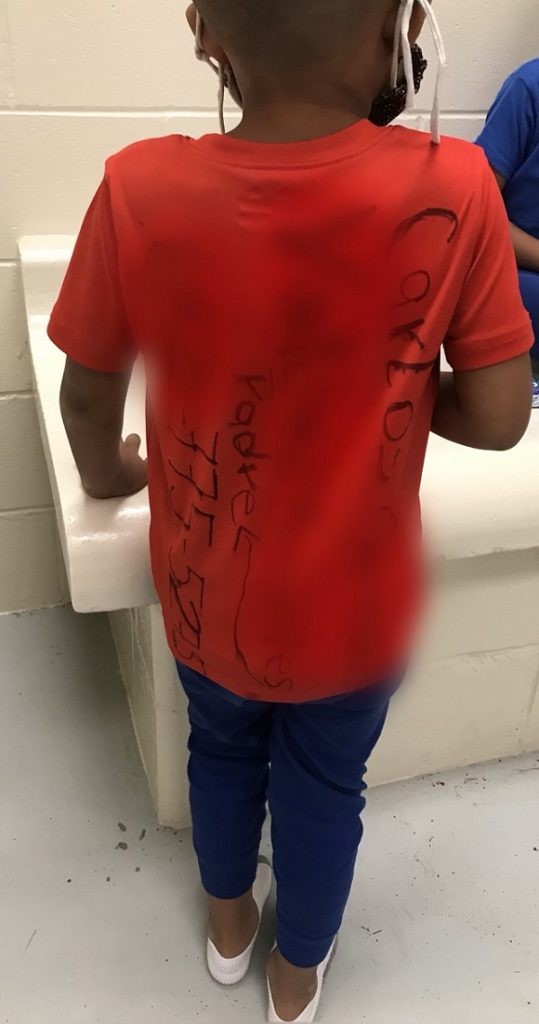 Human smugglers marked a name and U.S. phone number on the shirt of a child abandoned on the Rio Grande riverbank. (Photo: U.S. Border Patrol/Rio Grande Valley Sector)