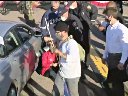 Photographer Grabs Woman's Trump Sign