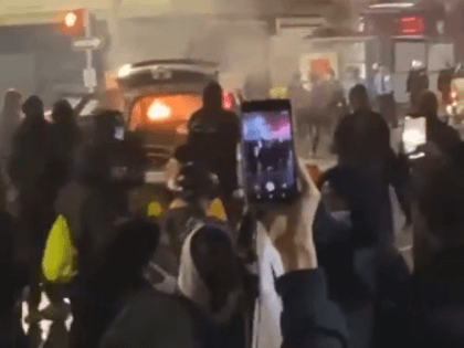 Rioters set police car on fire in Philadelphia. (Twitter Video Screenshot)