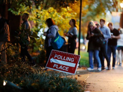 A line forms outside a polling site on election day in Atlanta, Tuesday, Nov. 6, 2018. (AP