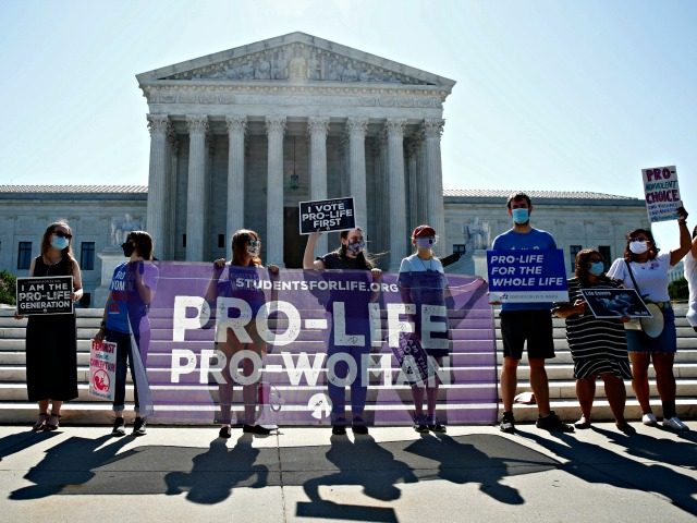 Anti-abortion protesters wait outside the Supreme Court for a decision, Monday, June 29, 2020 in Washington on the Louisiana case, Russo v. June Medical Services LLC. (AP Photo/Patrick Semansky)