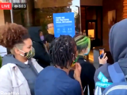 Seattle police make arrests after protesters invade KING5 NBC lobby on Thursday evening. (Twitter Video Screenshot)
