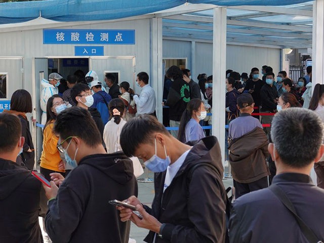 People line up to be tested for the COVID-19 coronavirus in Yantai, in China's eastern Sha