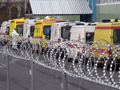 Ambulances are seen parked outside a temporary hospital for coronavirus patients set at th