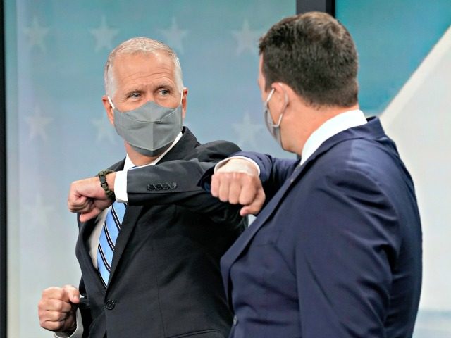 U.S. Sen. Thom Tillis, R-N.C., left, and Democratic challenger Cal Cunningham greet each other prior to a televised debate at WNCN-TV in Raleigh, N.C., Tuesday, Sept. 22, 2020. (AP Photo/Gerry Broome)