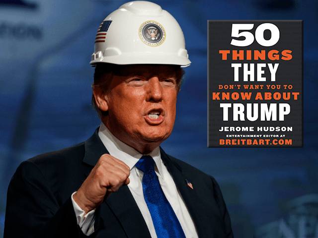 President Donald Trump pumps his fist after putting on a hard hat given to him before speaking to the National Electrical Contractors Association Convention at the Pennsylvania Convention Center, Tuesday, Oct. 2, 2018, in Philadelphia. (AP Photo/Evan Vucci)