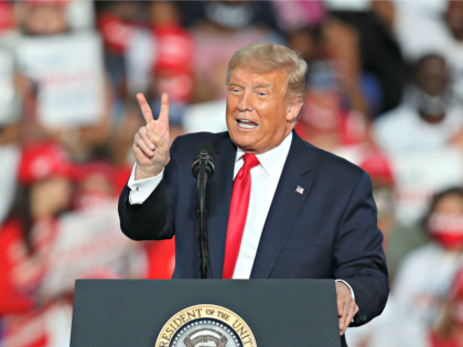 SANFORD, FLORIDA - OCTOBER 12: President Donald Trump speaks during his campaign event at the Orlando Sanford International Airport on October 12, 2020 in Sanford, Florida. Trump was holding his first campaign rally since his coronavirus diagnosis as he continues to campaign against Democratic presidential candidate Joe Biden. (Photo by …