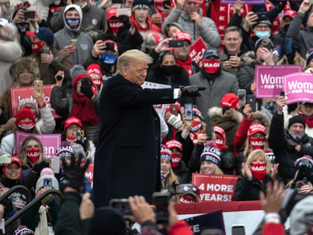 WATERFORD, MICHIGAN - OCTOBER 30: U.S. President Donald Trump greets supporters at a campaign rally at Oakland County International Airport on October 30, 2020 in Waterford, Michigan. With less than a week until Election Day, Trump and his opponent, Democratic presidential nominee Joe Biden, are campaigning across the country. (Photo by John Moore/Getty Images)