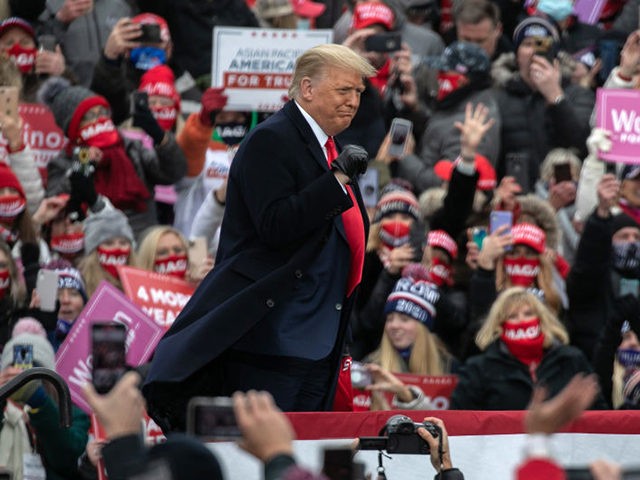 WATERFORD, MICHIGAN - OCTOBER 30: U.S. President Donald Trump greets supporters at a campaign rally at Oakland County International Airport on October 30, 2020 in Waterford, Michigan. With less than a week until Election Day, Trump and his opponent, Democratic presidential nominee Joe Biden, are campaigning across the country. (Photo …