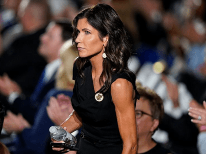 In this Aug. 27, 2020 file photo, South Dakota Gov. Kristi Noem stands in the crowd on the South Lawn of the White House during the fourth day of the Republican National Convention in Washington. Noem has no plans to get tested for the coronavirus before heading back to the …