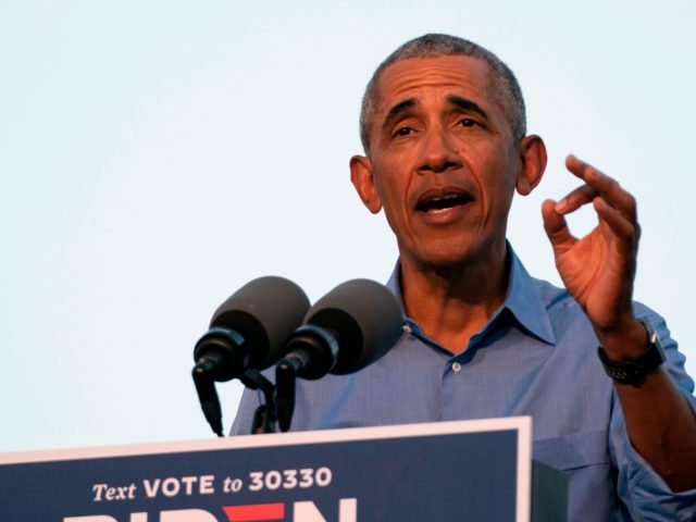 Former US President Barack Obama addresses Biden-Harris supporters during a drive-in rally