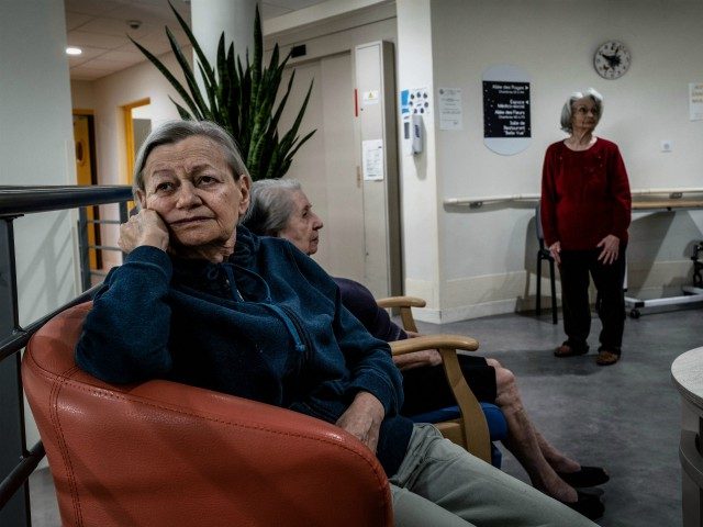 In this photograph taken on October 1, 2020, elderly residents gather in a common area at The Vilanova Care Home in Corbas, south-eastern France. - In mid-March, the Ehpad Vilanova, which opened in February 2018, was one of the first in France to confine staff and residents, so as not …