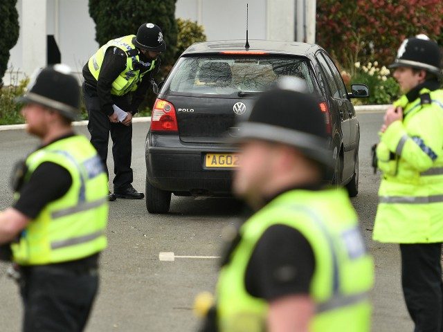 Police officers from North Yorkshire Police stop motorists in cars to check that their travel is "essential", in line with the British Government's Covid-19 advice to "Stay at Home", in York, northern England on March 30, 2020, as life in Britain continues during the nationwide lockdown to combat the novel …