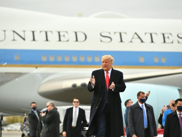 US President Donald Trump(C) arrives to speak during a campaign rally at Manchester-Boston Regional Airport in Londonderry, New Hampshire on October 25, 2020. - Donald Trump's reelection campaign on Sunday sought to brush off another Covid outbreak in his team by focusing its attacks on Joe Biden's energy levels and …
