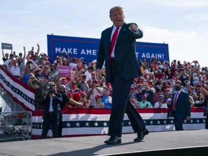 President Donald Trump arrives to speak to a campaign rally at Ocala International Airport, Friday, Oct. 16, 2020, in Ocala, Fla. (AP Photo/Evan Vucci)