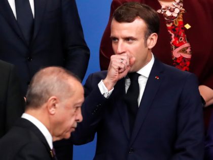 France's President Emmanuel Macron (C) gestures next to Turkey's President Recep Tayyip Er