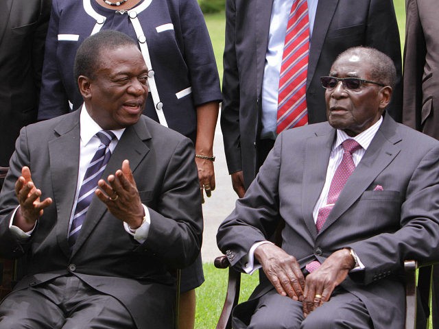 Emmerson Mnangagwa, left, Vice President of Zimbabwe chats with Zimbabwean President Rober