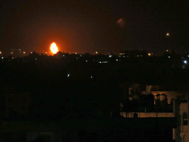 Flames are seen following an Israeli air strike in the town of Khan Yunis, in the southern