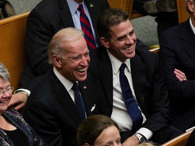 From right, Tom Daschle, Hunter Biden, Vice President Joe Biden, and daughters of George McGovern Ann McGovern and Susan Rowen, laugh as they listen to Matt McGovern, grand son of George McGovern, at a prayer service for the former Democratic U.S. senator and three-time presidential candidate George McGovern at the First United Methodist Church in Sioux Falls, S.D., Thursday, Oct. 25, 2012. McGovern died Sunday in his native South Dakota at age 90. (AP Photo/Nati Harnik)