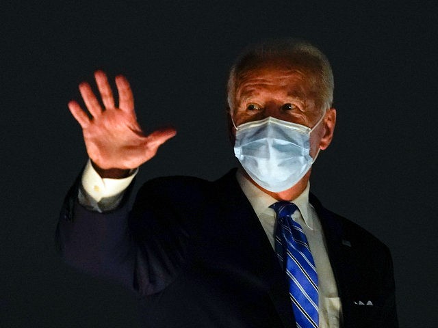 Democratic presidential candidate former Vice President Joe Biden boards his campaign plan