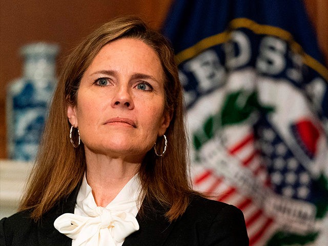 Judge Amy Coney Barrett, President Donald Trump's nominee for the US Supreme Court, meets with Senator Jerry Moran, R-KS on Capitol Hill in Washington, DC on October, 1, 2020. (Photo by Manuel Balce CENATA / POOL / AFP) (Photo by MANUEL BALCE CENATA/POOL/AFP via Getty Images)