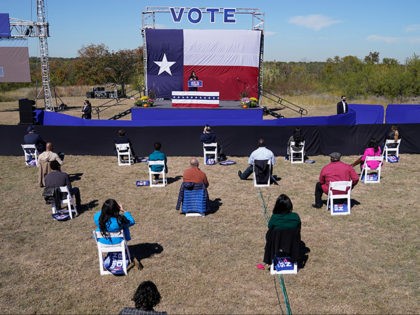 Supporters of Democratic vice presidential candidate Sen. Kamala Harris, D-Calif., socially distance as they listen to her speak at a campaign event Friday, Oct. 30, 2020, in Fort Worth, Texas. (AP Photo/LM Otero)