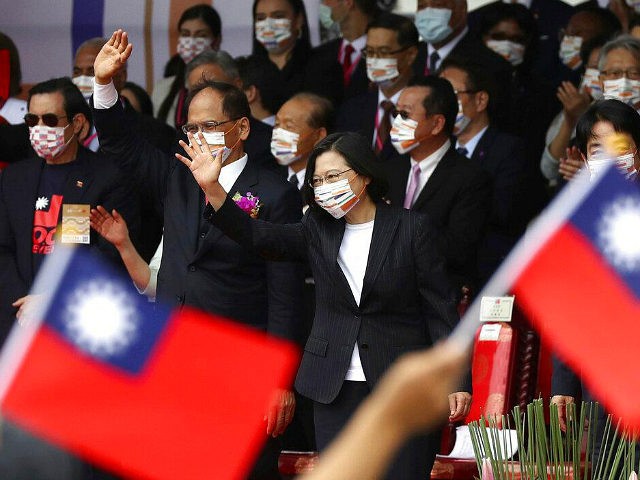 Taiwan's President Tsai Ing-wen, right, and Yu Shyi-kun, speaker of the Legislative Yuan, cheer with audience during National Day celebrations in front of the Presidential Building in Taipei, Taiwan, Saturday, Oct. 10, 2020. President Tsai said Saturday she has hopes for less tensions with China and in the region if …