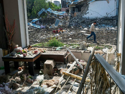 A man walks past a house destroyed by shelling by Azerbaijan's artillery during a military conflict in Stepanakert, self-proclaimed Republic of Nagorno-Karabakh, Thursday, Oct. 8, 2020. Armenia accused Azerbaijan of firing missiles into the capital of the separatist territory of Nagorno-Karabakh, while Azerbaijan said several of its towns and its …