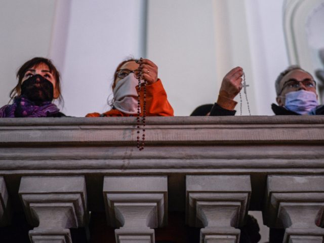 WARSAW, POLAND - OCTOBER 28: Members of far right associations stand on the stairs of the Holy Cross Church as pro choice march during the National strike for the seventh day of protests against the Constitutional Court ruling on tightening the abortion law on October 28, 2020 in Warsaw, Poland. …