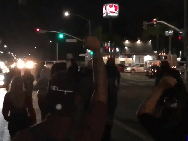 Protesters take to streets of San Bernardino Friday night to protest a police shooting of an armed Black man. (Twitter Video Screenshot/Drew Hernandez)