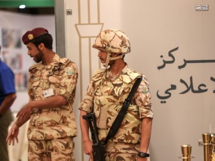 Saudi security forces stand guard at the press centre of a summit of Islamic nations in th