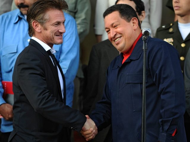 Venezuelan President Hugo Chavez (R) greets US actor Sean Penn after a meeting in Miraflor