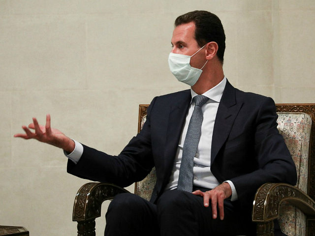FILE - In this Monday, Sept. 7, 2020 file photo released by Russian Foreign Ministry Press Service, Syrian President Bashar al-Assad gestures while speaking to Russian Foreign Minister Sergey Lavrov during their talks in Damascus, Syria. U.N.-backed investigators in the 21st report from the Commission of Inquiry on Syria, pointed …