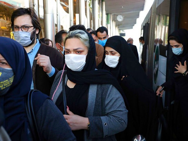 FILE - In this Sunday, Oct. 11, 2020 file photo, people wear protective face masks to help prevent the spread of the coronavirus in downtown Tehran, Iran. For the second day in a row, Iran announced Monday its highest single-day death toll from the coronavirus with 272 people killed. The …