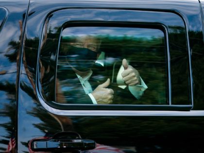 President Donald J. Trump greets supporters during a drive by outside of Walter Reed Natio