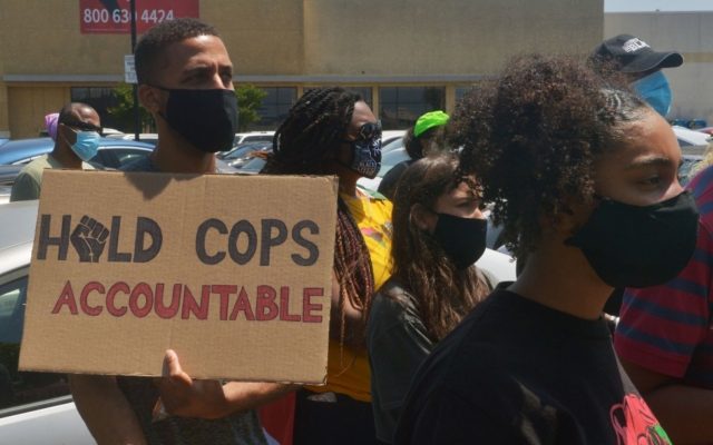 Judge orders Justice Department's police commission to halt work