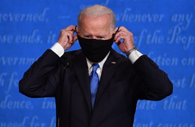 Biden promises to 'shut down the virus' in Iowa drive-in rally