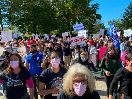Demonstrators march in the nationwide Women's March on October 17, 2020, at Freedom Plaza
