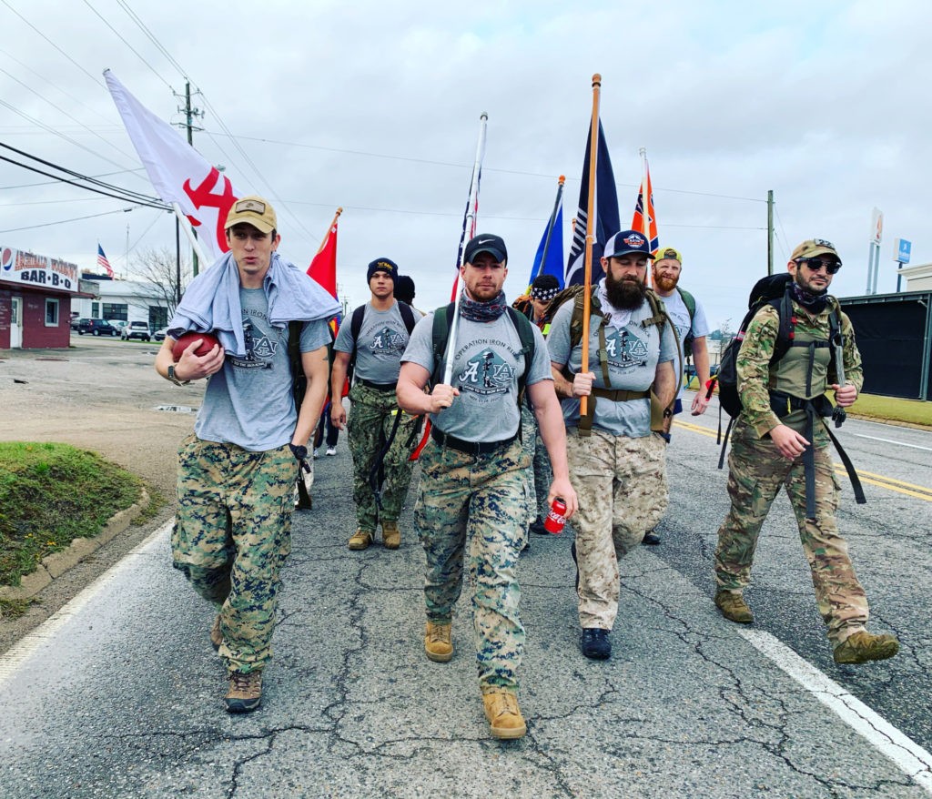Veterans from the University of Alabama and Auburn University united as one last week to march 150 miles to raise awareness for the 22 veterans lost each day to suicide.