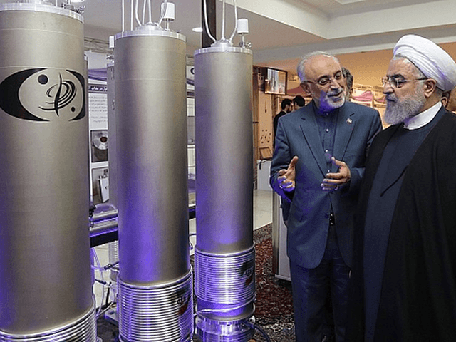 In this April 9, 2018, file photo, released by an official website of the office of the Iranian Presidency, President Hassan Rouhani listens to explanations on new nuclear achievements at a ceremony to mark "National Nuclear Day," in Tehran, Iran. Iranian Foreign Minister Mohammad Javad Zarif acknowledged Monday, July 1, …