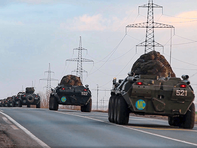 This photo made from the footage provided by Russian Defense Ministry press service on in Tuesday, Nov. 10, 2020 shows Russian military vehicles carry peacekeepers on their way to an airport in unknown place in Russia. Scores of Russian peacekeepers were heading to Nagorno-Karabakh on Tuesday morning, hours after Armenia …