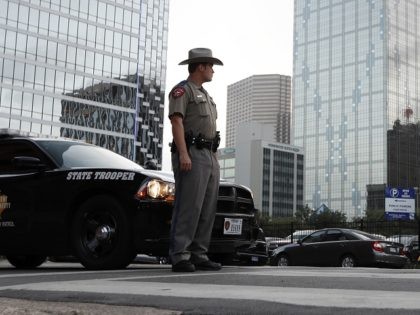A Texas state trooper stands at a roadblock in Dallas. (AP Photo/Eric Gay)