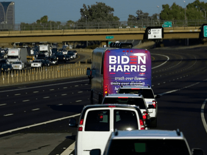 The bus carrying Democratic presidential candidate former Vice President Joe Biden and Democratic vice presidential candidate Sen. Kamala Harris, D-Calif., heads to a campaign stop in Phoenix, Thursday, Oct. 8, 2020. (AP Photo/Carolyn Kaster)